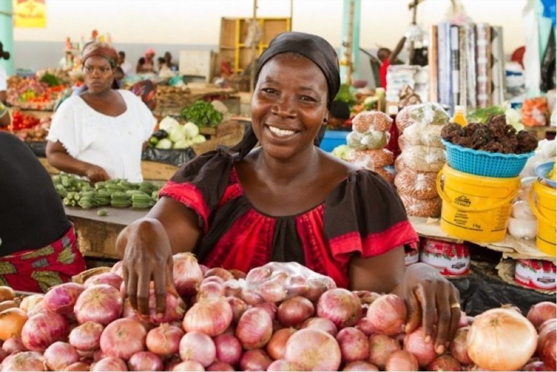 Liberian market vendor selling fresh onions